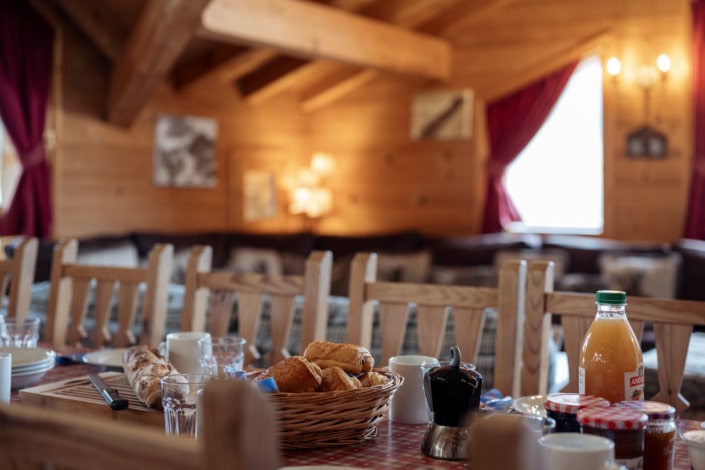 Chalet Jamais Bleu Close up Breakfast Dining Table and Loung blurred