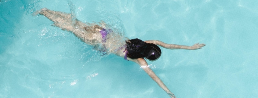 Person swimming in an indoor pool at Aquamotion leisure centre in Courchevel
